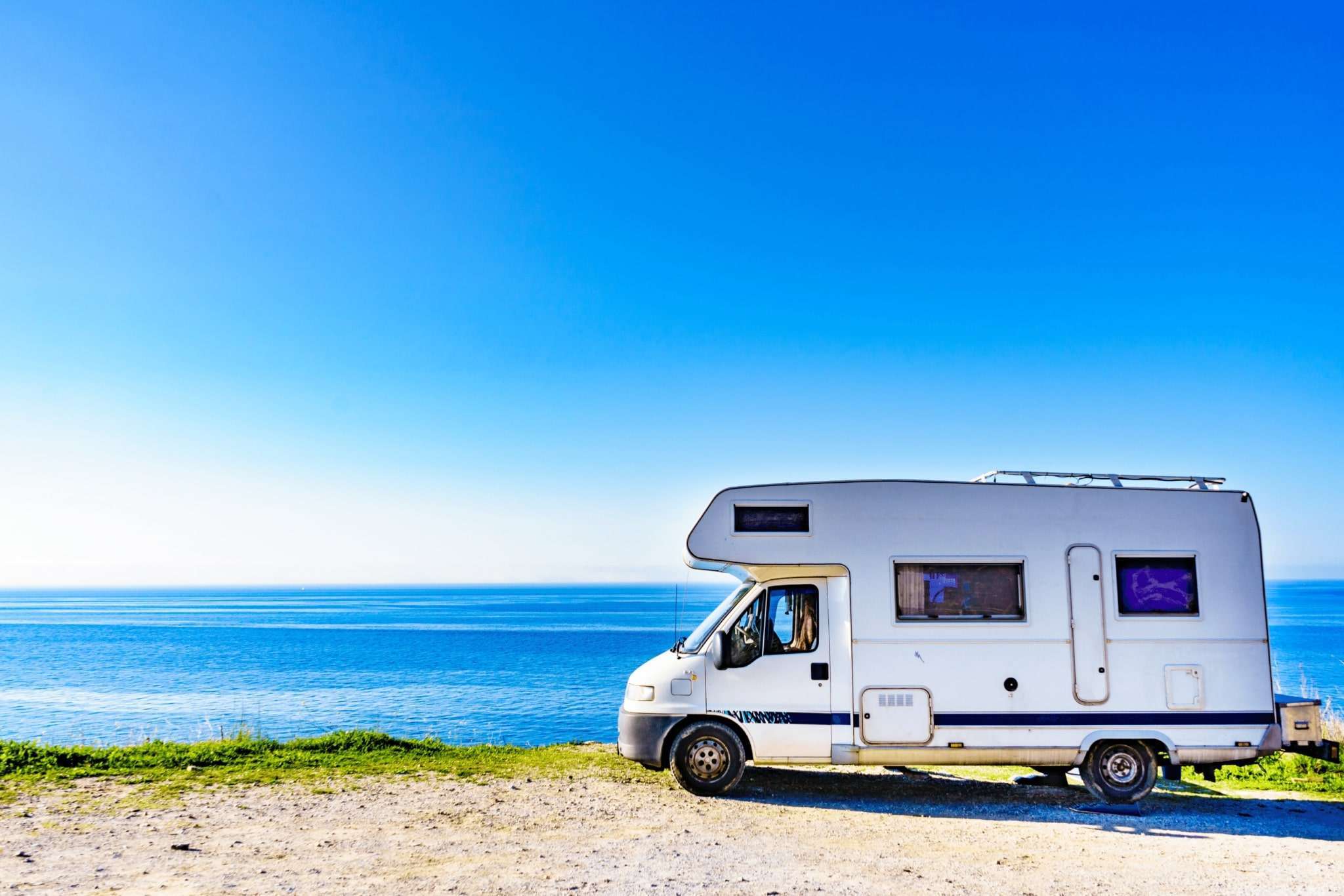RV parked by the sea
