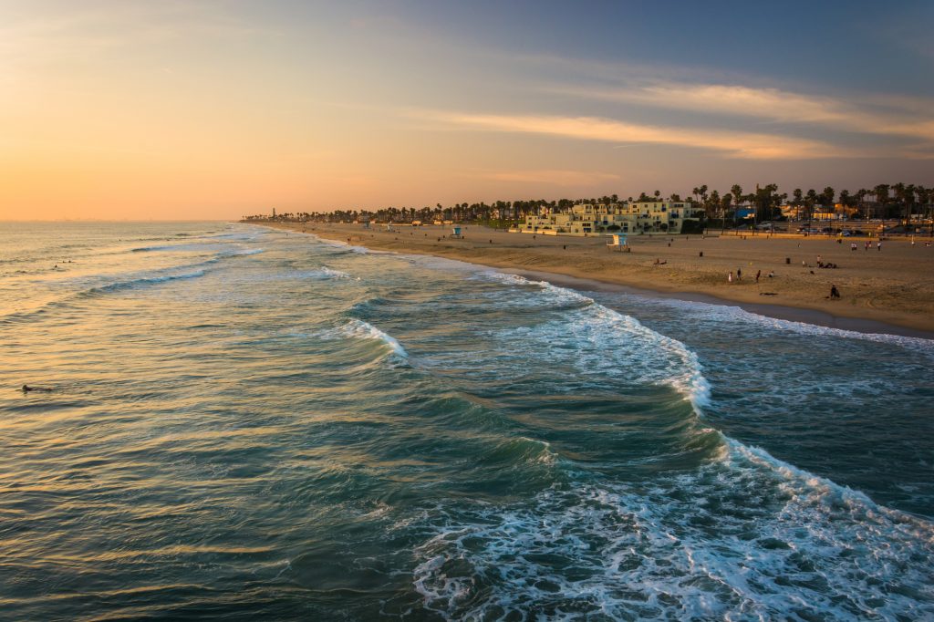 View of the beach at sunset, in Huntington Beach, California.